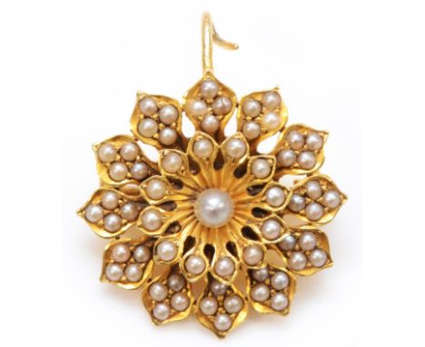 A Victorian unmarked 18ct gold and half pearl flower head brooch, 23mm, 5.5gm 