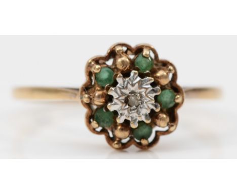 A 9ct gold diamond and emerald cluster ring, claw set, O, 1.7g 