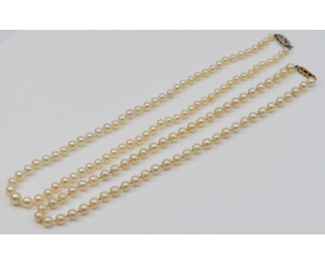 A vintage graduated cultured pearl necklace, 8mm to 4mm, diamond set 9ct gold clasp, 48cm and another 6mm bead necklace, 45cm
