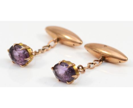 A Victorian pair of unmarked 15ct gold and amethyst cufflinks, torpedoes 22mm, 5.1gm 