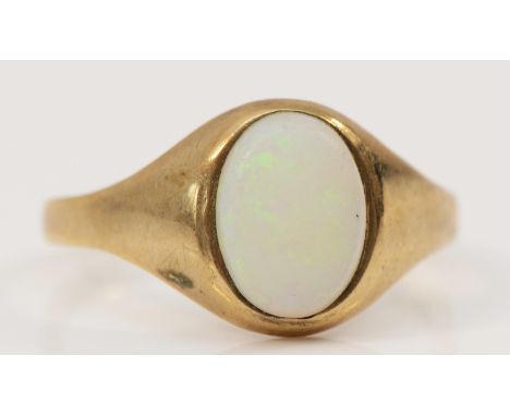 A 9ct gold cabochon cut opal signet ring, bezel set, I, 1.3g 