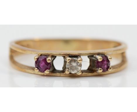 A 9ct gold vintage ruby and diamond three stone ring, claw set, K 1/2, 1.3g 