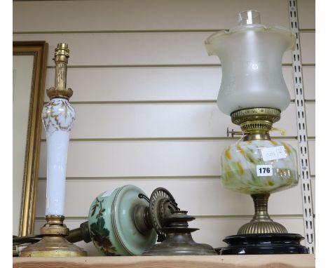 Two early 20th century oil lamps and another lamp