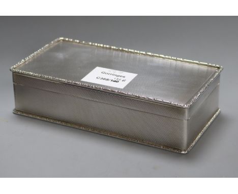 A 1960's engine tuned silver cigarette box, Birmingham, 1964, 17.2cm.