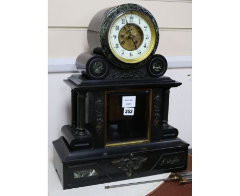 A Victorian black slate and green marble mantel clock height 48cm