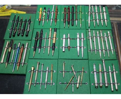 A collection of vintage propelling pencils in a tin case (57)