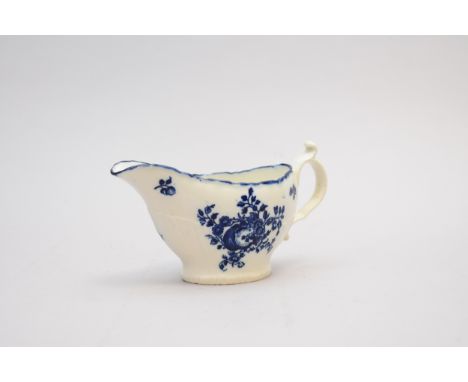 A Caughley 'Sliced Fruit' sauce boat circa 1780 of a rare shape scalloped upper rim and partial strap-fluted moulding the bod