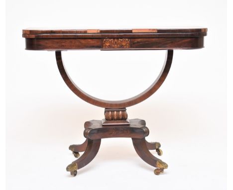 A Regency style rosewood fold-over card table, 19th century, the hinged D-shaped top above a U-shaped support on scrolled leg