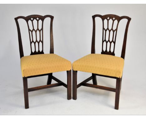 A set of six 19th century mahogany dining chairs in the manner of Thomas Chippendale, the shaped top rails above openwork Got