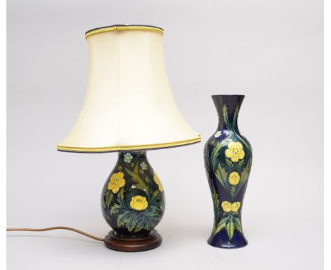 A Moorcroft 'Buttercup' table lamp with original shade together with a vase in the same pattern, painted and impressed marks,