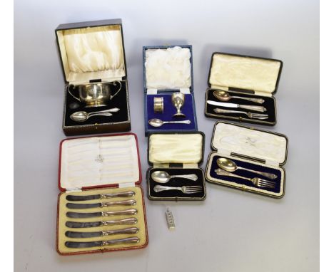 A collection of cased silver wares, comprising; a Christening set composed of an egg cup, spoon and napkin ring, Deakin &amp;