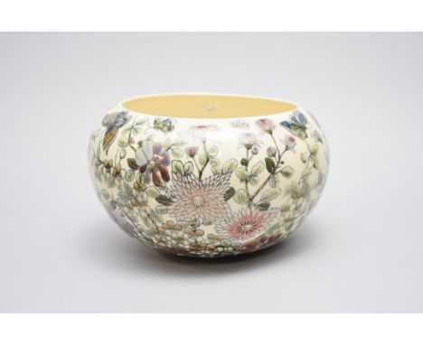 A Zsolnay Pecs planter circa 1879-1898 transfer-printed and gilded with scattered butterflies flying amongst foliage, printed