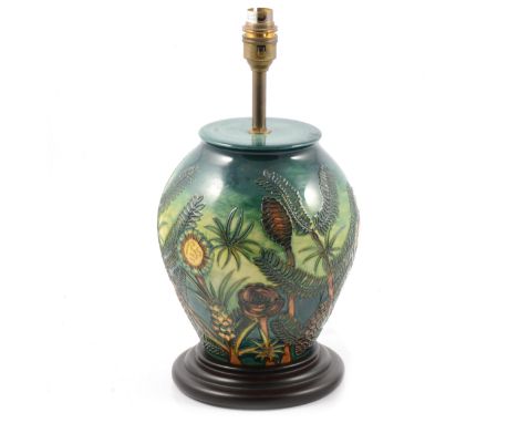 Moorcroft Pottery lamp base with tubelined pine cone design, mounted on a wooden base, 34cm including fittings.