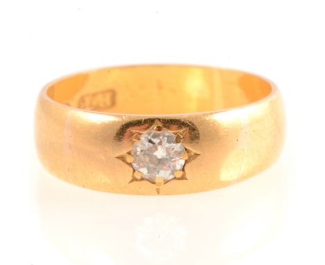 A 22 carat yellow gold wedding band star gypsy set with an old cut diamond, 5.5mm wide plain polished half D shape, Birmingha