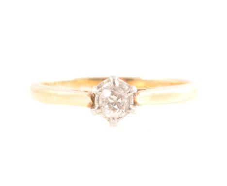 A diamond solitaire ring, the old brilliant cut stone claw set in a yellow and white metal mount, ring size Q, approximate we