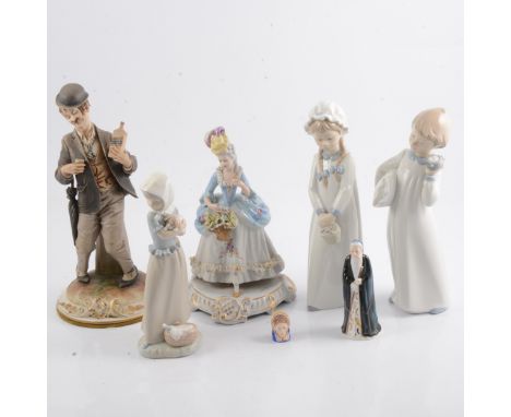 Seven ceramic figures including a Nao child holding a puppy, and a Capodimonte drunkard holding a bottle of whisky.