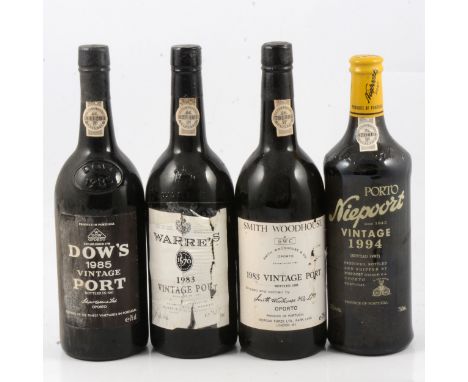 Four bottles of assorted Port, including: Dows 1985 vintage; Warre's, 1983 vintage (labels heavily torn); Smith Woodhouse, 19