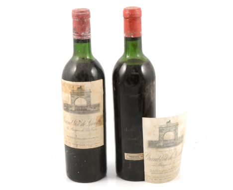 Ch Leoville-las Cases, Grand Vin de Leoville, Saint-Julien, 1961, and one unknown vintage, low levels, labels off/ taped.
