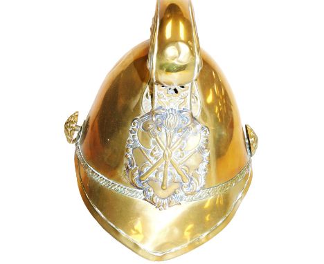 A late 19thC Merryweather-type fireman's helmet, with an embossed dragon comb cresting, and applied to the front with crossed