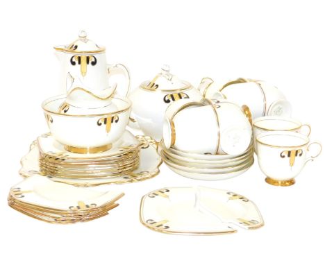 A Tuscan Plant porcelain tea service, comprising teapot, hot water jug and cover, cream jug, sugar bowl, bread plate, ten tea