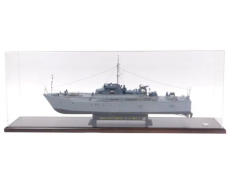 An Italeri kit and scratch built Royal Navy Vosper MTB77, scale 1:35, on a cradle, Perspex cased with book and associated lit