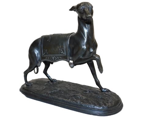 A late 19thC French spelter figure of a greyhound, modelled standing with a rug over its back bearing a coat of arms, raised 