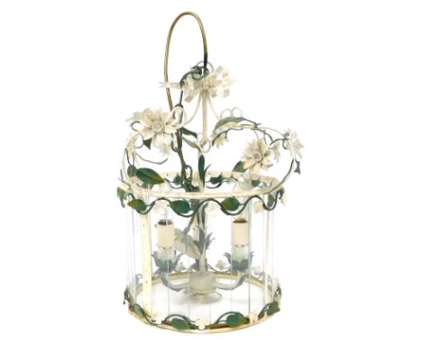 A 20thC wrought iron ceiling light, three arm, with a cylindrical shade, decorated with trailing flowers and leaves, with a s