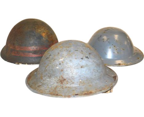 Two WWII Air Force Defence helmets, and a further helmet. (3)