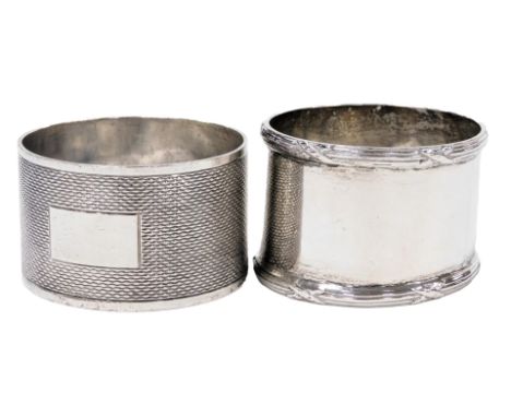 A George V silver napkin ring, Chester 1928, and a further silver napkin ring, with engine turned decoration, 2.25oz.