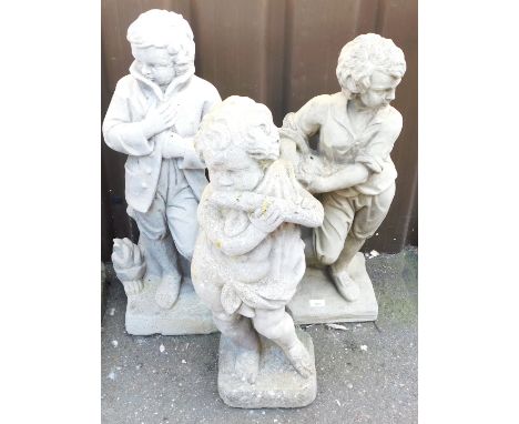 Three concrete garden figures, comprising a boy wrapped in a coat, 78cm high, a putto playing a musical instrument, 70cm high