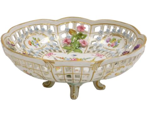 A 20thC Dresden porcelain sweetmeat basket, encrusted and reserve painted with flowers, floral swags and insects, raised on f