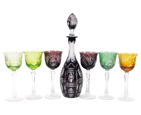 A set of six Bohemian flashed glass wine glasses, each with a coloured glass bowl, raised on a faceted and waisted octagonal 
