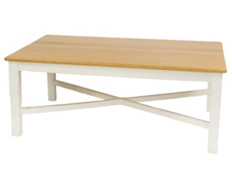 A light oak and cream painted dining table, raised on stiles united by a X-frame stretcher, 77cm high, 197cm wide, 116cm deep