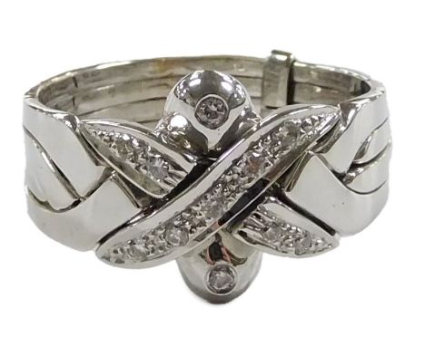 An 18ct gold and diamond set four band ring, in an X frame design, size R, 6.8g. 