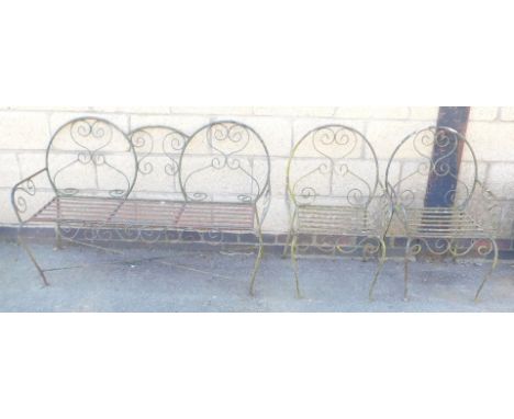 A cast and wrought iron three seater garden bench, 132cm wide, together with a pair of matching chairs.
