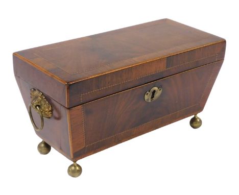 A Regency mahogany tea caddy, with rosewood crossbanding, and brass vine and ring handles, the rectangular hinged lid opening