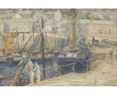 British School (Early 20thC).  Fishing village with boats in the harbour, watercolour, 25cm x 37cm.
