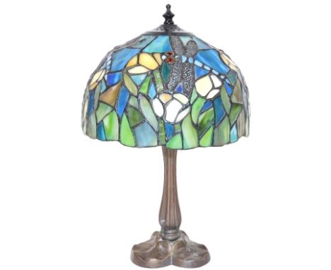 A Tiffany style table lamp, with a circular shade, decorated with dragonflies, 39cm high. 
