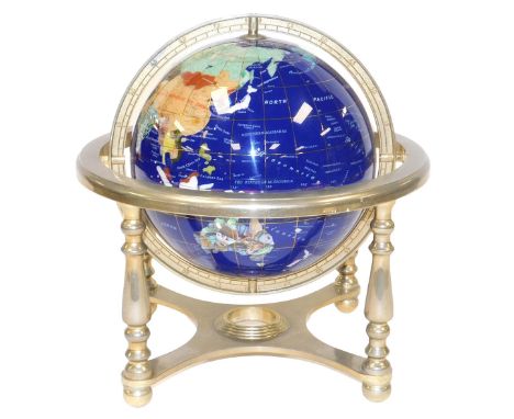 A hard stone terrestrial globe, in a white metal gimbal frame, frame 31cm wide.