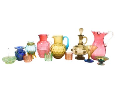 A group of Victorian and later coloured glassware, including cranberry glass jugs, continental brown glass jug and stopper, m