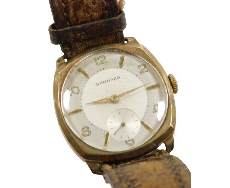 A Garrard gentleman's 9ct gold cased wristwatch, circular silvered dial, with chapter ring bearing Arabic numerals at evens, 