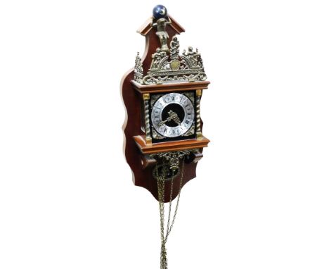 A Dutch Atlas wall clock, square dial with cherub spandrels, silver chapter ring bearing Roman and Arabic numerals, two train