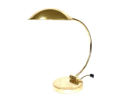 A late 20thC brass desk lamp, with a curved arm, raised on a circular base, 42cm high.Buyer Note: WARNING! This lot contains 
