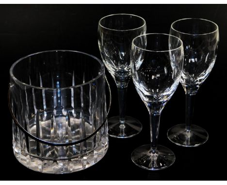 Three Waterford crystal wine glasses, designed by John Rocha, together with a cut glass ice bucket. (4)