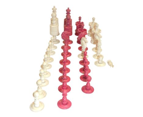 A 19thC white and red stained bone chess set, king 8.5cm high.  (AF)