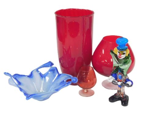 A Murano blue glass dish, of abstract square form, bears label, 22.5cm wide, a Murano glass clown, ruby glass vase, of taperi