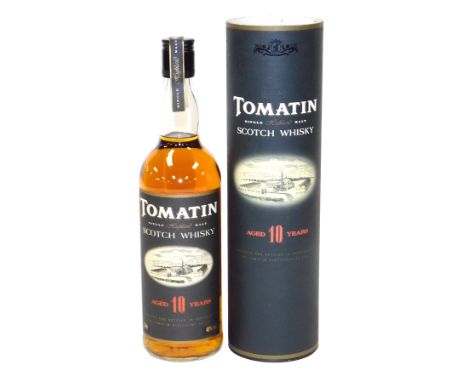 A bottle of Tomatin Single Highland Malt Scotch whisky, aged 10 years, cased.