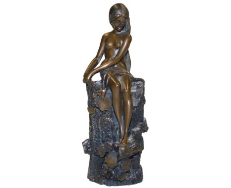 A Giovanni Schoeman bronzed sculpture of a wood nymph, modelled seated on a tree trunk, signed, dated '75, 14cm high. 