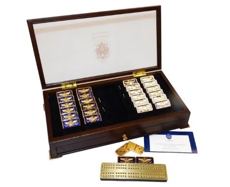 A Franklin Mint House of Faberge Imperial domino set, containing 28 blue guilloche enamel minted dominoes, decorated with the
