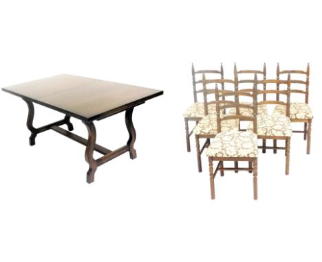 A Younger dark oak draw leaf dining table, raised on shaped supports, united by a H frame stretcher, 73cm high, 158cm wide, 2